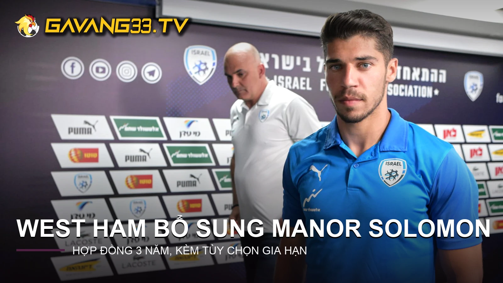 Manor Solomon tại buổi họp báo đội tuyển Israel, có logo GavangTV